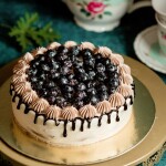 Chocolate cake decorated with red and white glaze